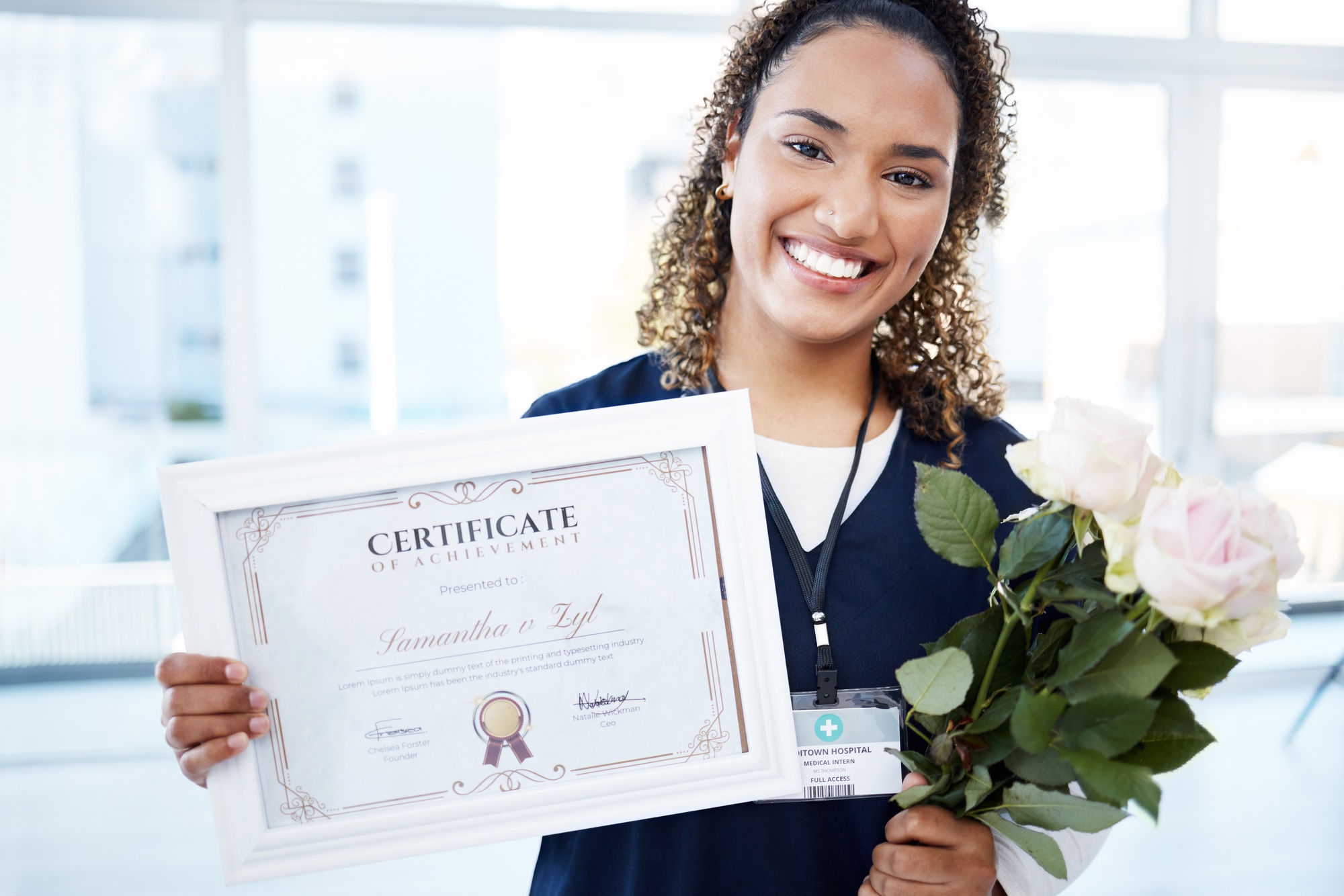 Certificate, flowers and portrait with a black woman graduate in the hospital, proud of her achieve